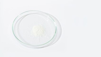 White powder in a Petri dish. Cocaine, cannabinoid, medicinal powder, antibiotic. lab, research.