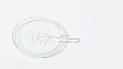 White powder in a Petri dish. Cocaine, cannabinoid, medicinal powder, antibiotic. lab, research.
