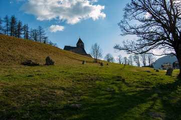 Field of Menhirs with Medieval Chapel in Background