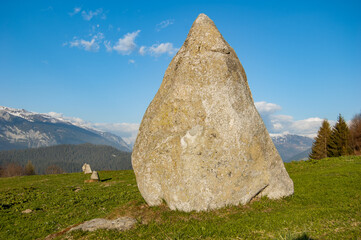 Large Standing Stone in Line with smaller Megaliths in Parc la Mutta, Falera, Switzerland
