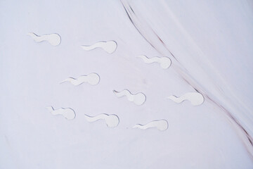 Fertility, sperm made of paper fertilizing egg, sex education.