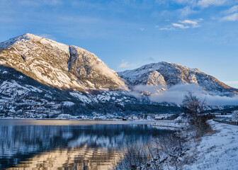 Eidfjord village and mountains at sunset during winter on Hardangerfjord, Norway