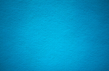 Photo of a blue background texture for text.Felt background of sea color.