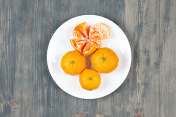 Top view fresh sliced orange on dark background ripe mellow fruit juice color citrus tree citrus, Whole and sliced ripe oranges placed on marble background, half orange fruit.