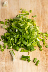 sliced washed green onions on a board