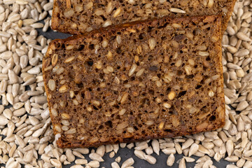 Black rye bread cut into chunks with sunflower seeds