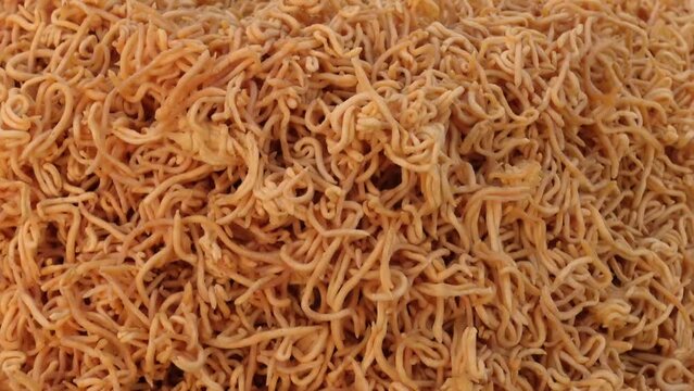 Handmade yellow Jhuri vaja crunchy snack food. Locally called Jhuri vaja. Bangla Pohela Baishakh fair's traditional food.