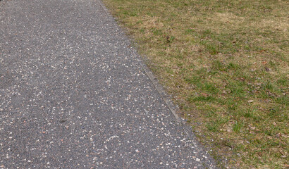 Obraz premium a gravel and stone-strewn walking path in the park