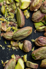 Crispy delicious pistachios with salt on the table