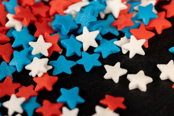 small star shaped confectionery decorations, close up