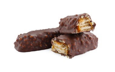 Pieces of chocolate bars with caramel on white background