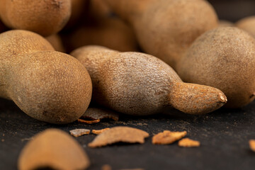long ripe tamarind pods close up