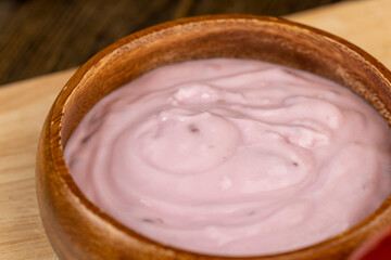 fresh yogurt with berries and fruits with red oranges