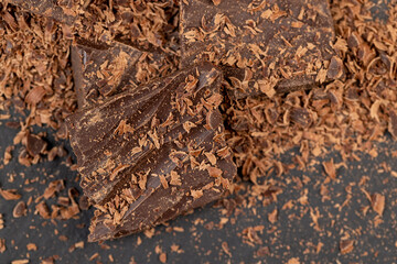 a crumbled piece of bitter chocolate into small pieces