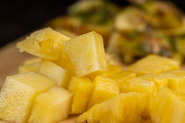 Sliced into pieces of fresh ripe peeled pineapple