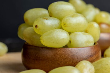Ripe green grapes on the kitchen table