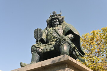 Japan sightseeing trip. A bronze statue of Takeda Shingen, a military commander during the Sengoku period. The location is in front of Kofu Station, Kofu City, Yamanashi Prefecture.