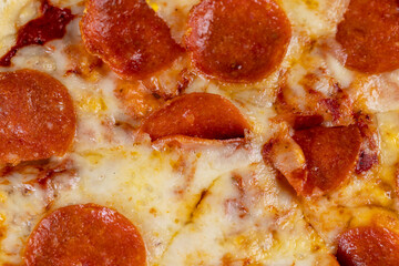 small homemade spicy pizza with sausage and cheese