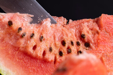 red watermelon cut into pieces on the table