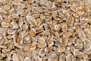 a bunch of fresh dry oatmeal flakes for making porridge