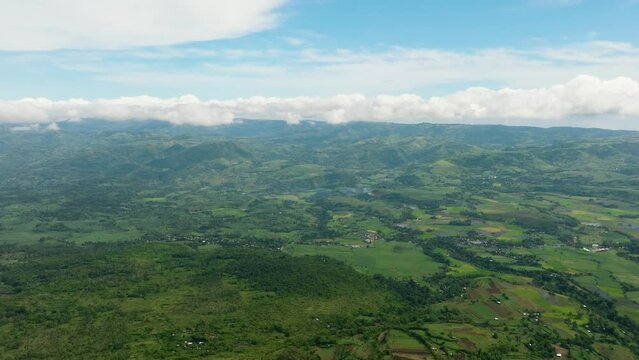 Aerial view of valley with farmland and agricultural land in mountainous area. Negros, Philippines