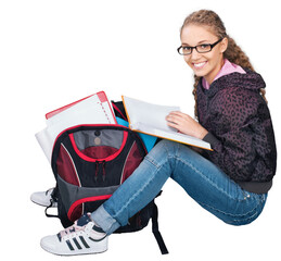 Friendly Young Girl with Rucksack and Book Sitting on Ground - Isolated