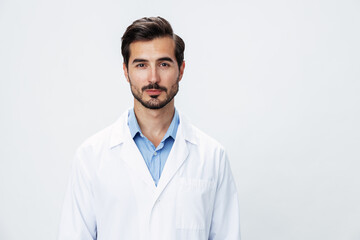 Man doctor in white coat looking into camera on white isolated background, copy space, space for text, health