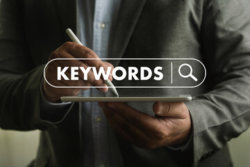 businessmanman search website for content keywords on laptop browse in office optimize seo engine - obrazy, fototapety, plakaty