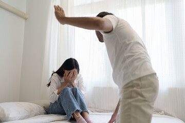 Obraz premium Domestic violence and Family conflict concept, father fighting mother with quarrel at home.