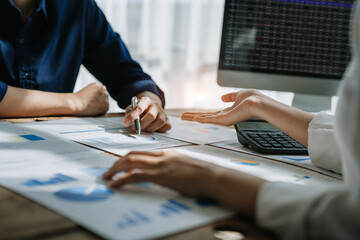startup business, business advisor strategy for planning finance investment teamwork paperwork audit and discussing marketing, profit, budget of company in meeting room, stock market chart concepts.