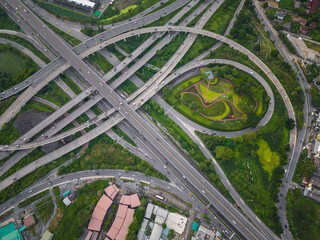 Aerial view city transport junction road with green tree forest park