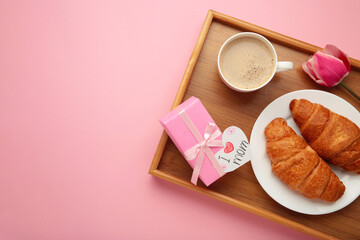 Happy mother's day, beautiful breakfast on tray, lunch with cup of coffee, fresh croissants, tulip...
