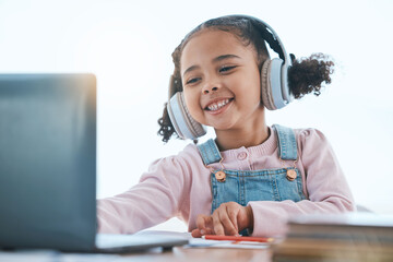 Computer, headphones and child listening in virtual class for e learning, language translation or...
