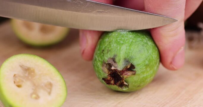 cut delicious sweet and sour green feijoa on the table, harvested a small amount of oriental feijoa fruit