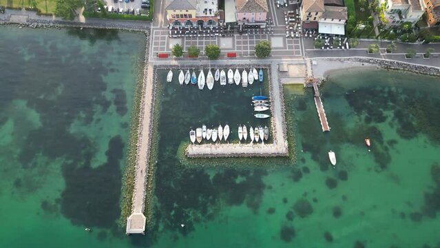 Overhead View Of Boats In The Port of Cisano In Lake Garda, Italy. - aerial