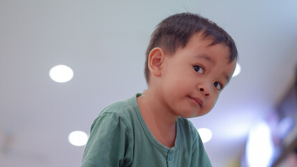 Portrait of cute Asian little boy. Look at the camera.
