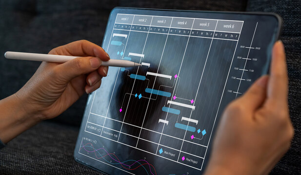 Human use tablet with calendar schedule time plan appointment, data management system, checking organizes day, week, month project list, business, calendar appointment plan concept