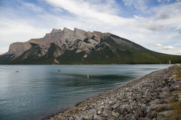 Summer vacation in the mountains - a trip to Lake Minnewanka. Rocky mountains, clear blue water,...