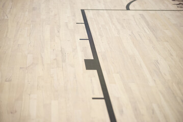 Basketball court parquet in indoors sport gym