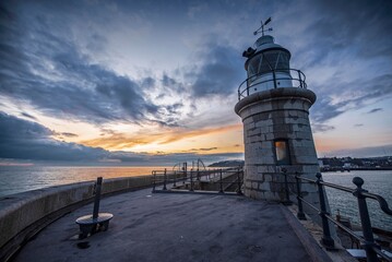 Fototapeta na wymiar The Folkestone lighthouse at dusk.