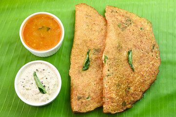 Adai dosa breakfast on banana leaf.