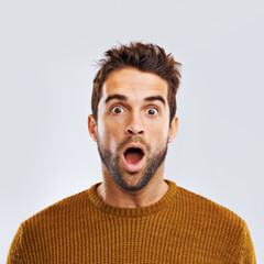 Shock, surprise and portrait of a man in a studio with an amazed facial expression or attitude. Shocked, amazing news and male model with a wtf, omg or wow face gesture isolated. by white background. - obrazy, fototapety, plakaty
