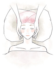 リラックスしてフェイシャルマッサージを受ける女性