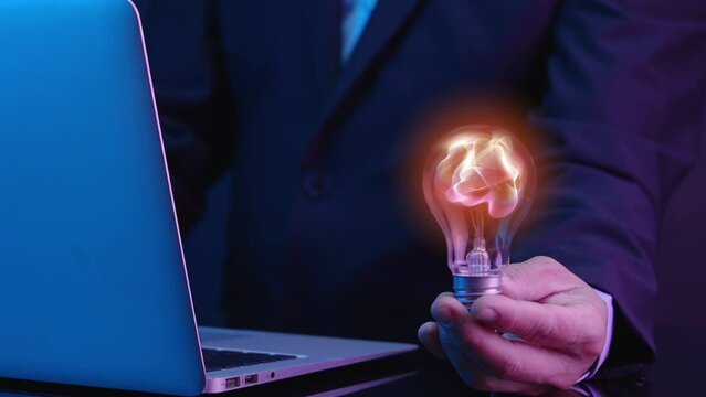 Businessman shows abstract particles in light bulb, AI artificial intelligence, chat bot, machine learning concept, big data, cloud computing, computer network and futuristic innovation technology