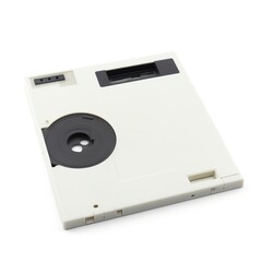 A 3.5-inch floppy disk or diskette is depicted on a white background, Generative AI.