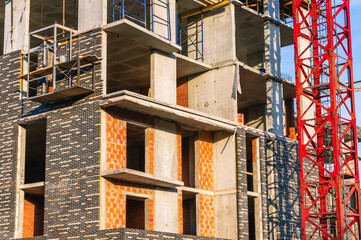 A frame made of load-bearing reinforced concrete walls during the construction of a multi-storey...