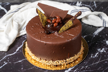 Chocolate cream cake. Birthday or celebration. Pistachio, Chocolate and Cream Cake. Close up