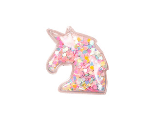 isolated pink unicorn with glitter and beads inside, handmade decoration accessory