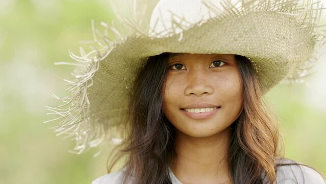 Closeup portrait of happy young asian female in hat, ethnicity and diversity