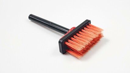 Black stem brush with red bristles on a white background